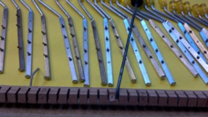 Ebay accordion with busted walnut guides for bass buttons